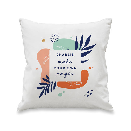 Front view of a white tropical-print cushion personalised with the name Charlie