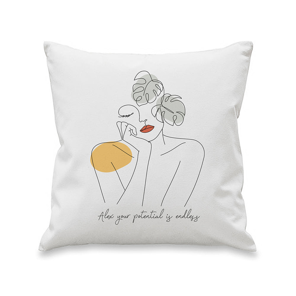 White cushion with a line-art figure, yellow flower and personalised script