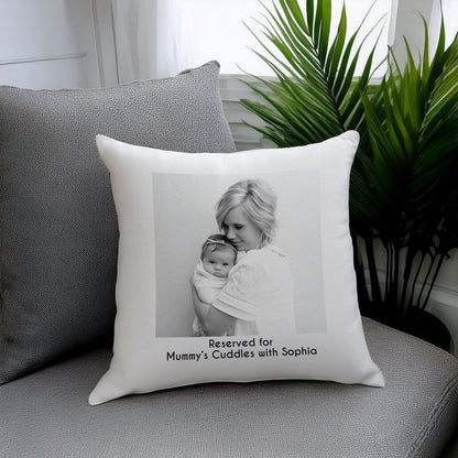 Personalised photo cushion with a mother and baby portrait on a sofa