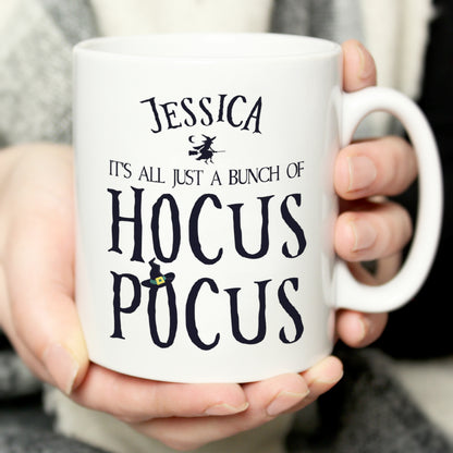 Hand holding a personalised Halloween Hocus Pocus mug