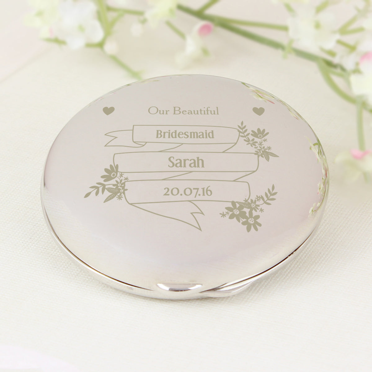 Nickel-plated Garden Bloom compact mirror shown closed