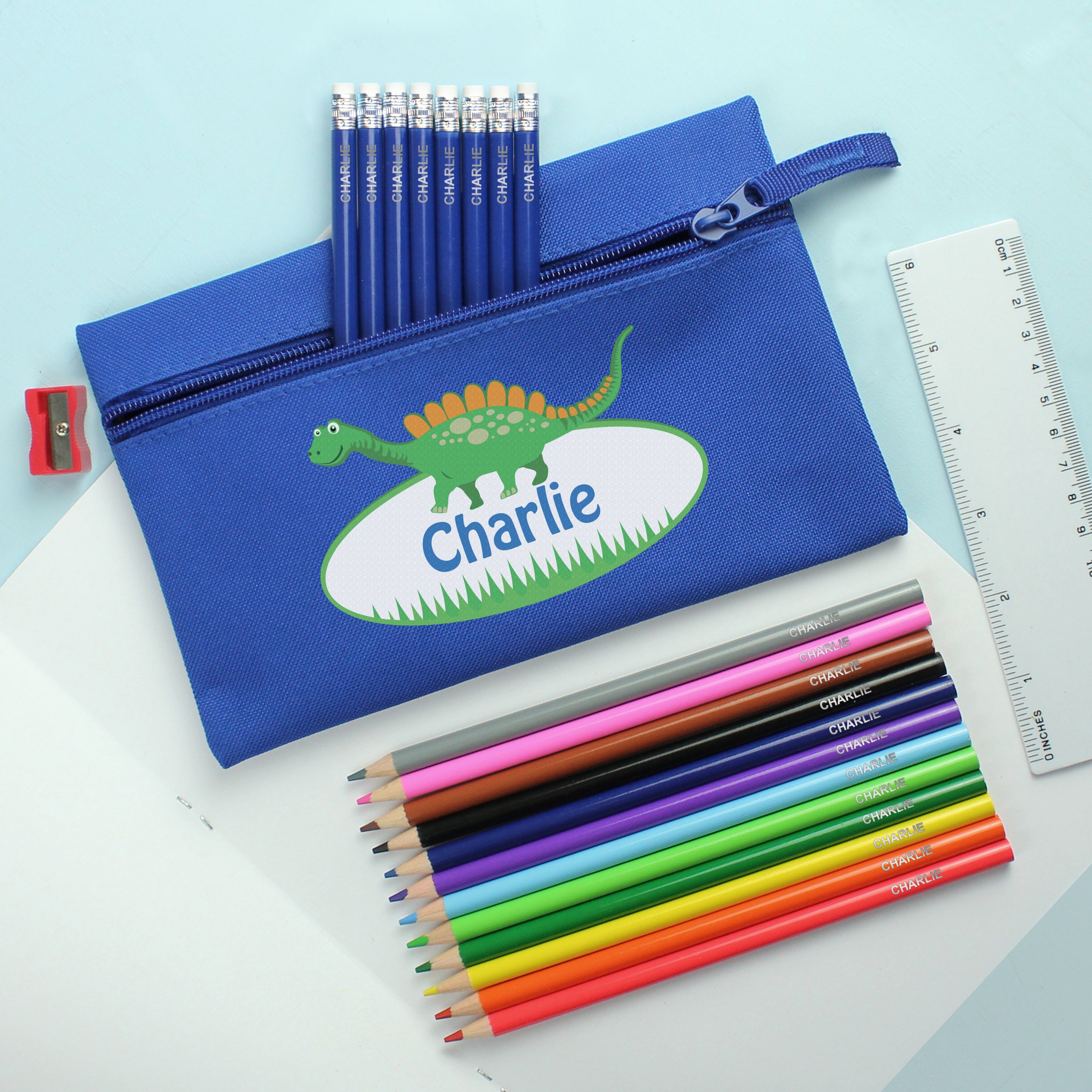 Blue Dinosaur Pencil Case with Personalised Pencils & Crayons from Heartfelt Gifts