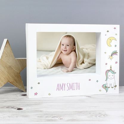 White Baby Unicorn box frame on a shelf with a baby under a blanket and Amy Smith example name