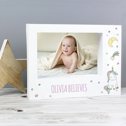 White Baby Unicorn frame with a baby photograph and Olivia Believes example wording