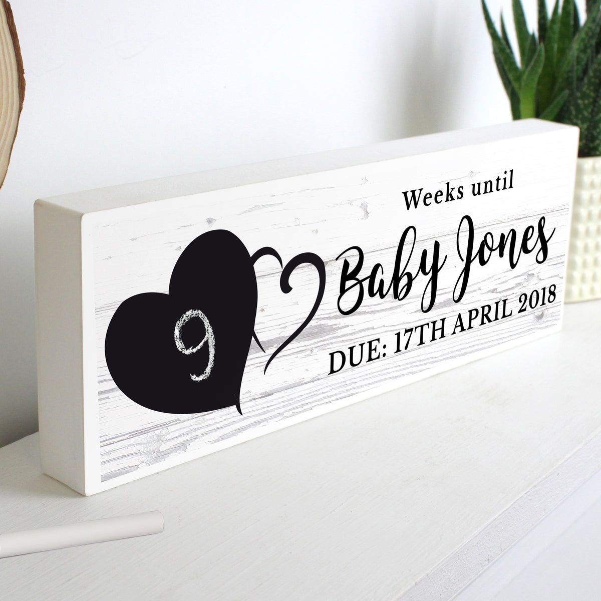 Personalised rustic countdown decoration shown on a mantel