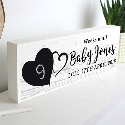 Personalised rustic countdown decoration shown on a mantel