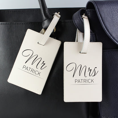 Pair of classic cream leather luggage tags personalised for a couple