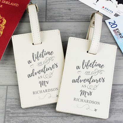 Pair of cream leather Lifetime of Adventures luggage tags for a couple